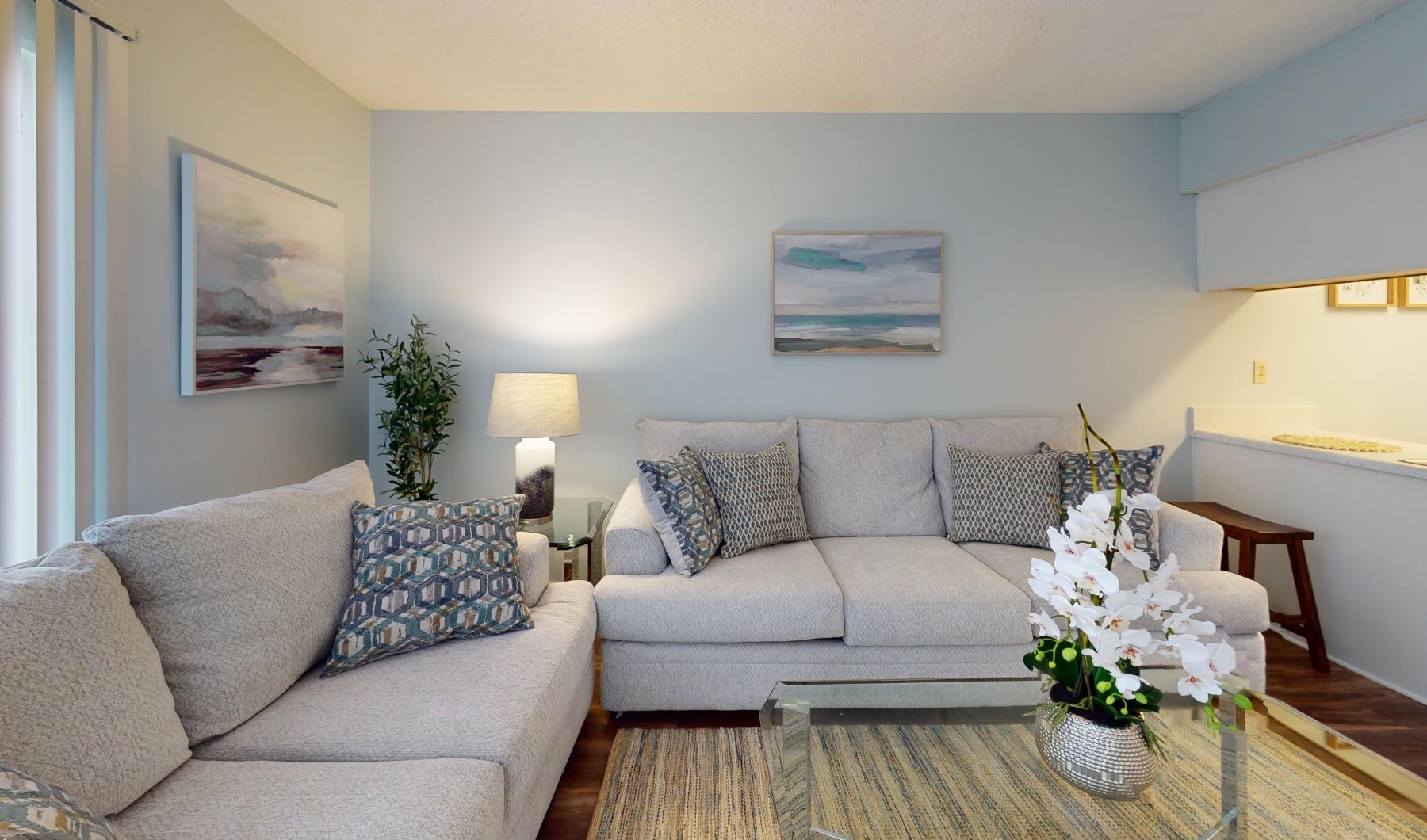 Settle into comfort at Serenity at West Columbia a living room with a couch and a coffee table